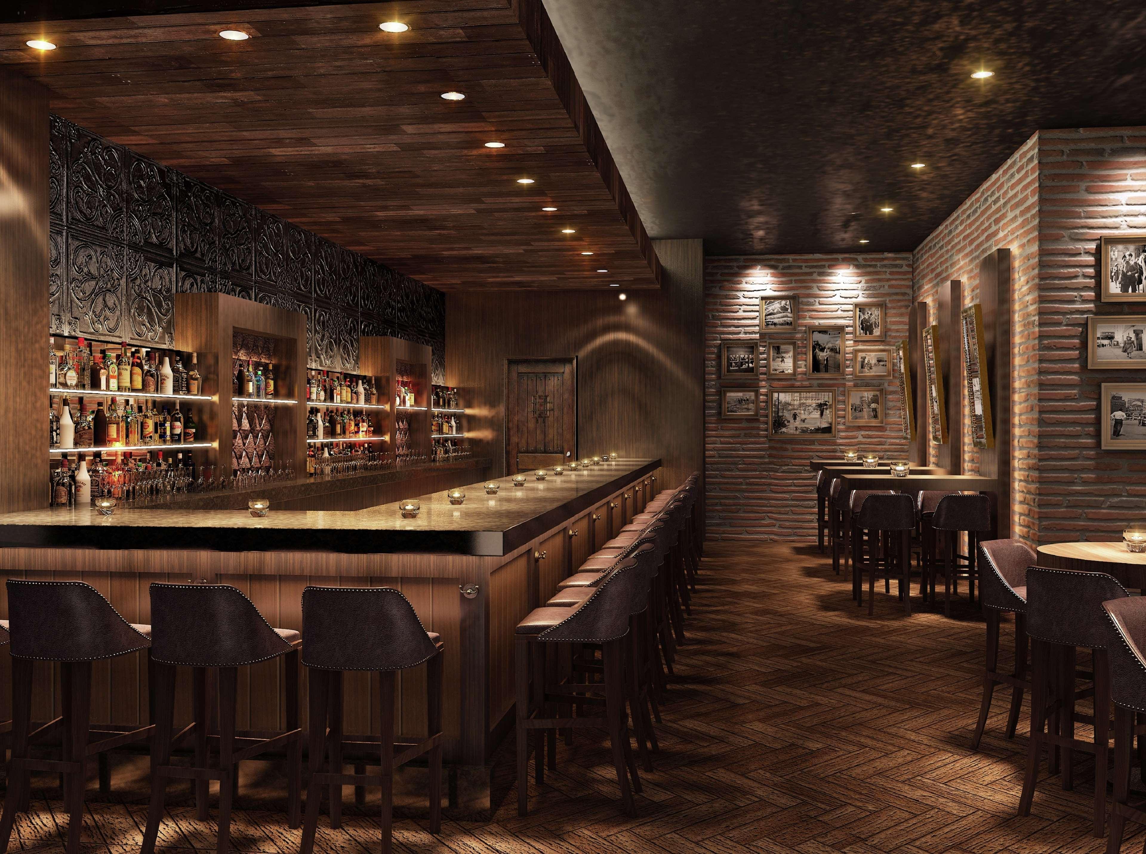 Отель Doubletree By Hilton Doha - Al Sadd Экстерьер фото The interior of the bar